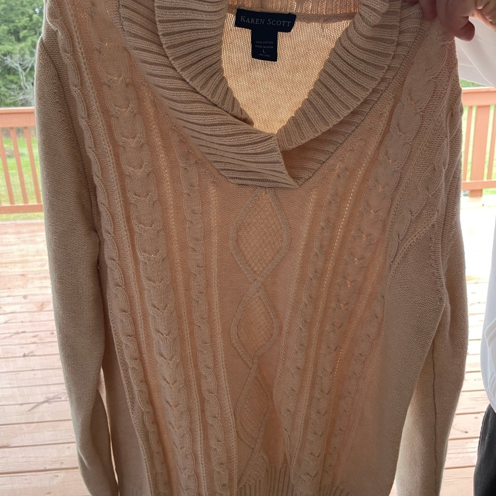 Women’s tan sweater.